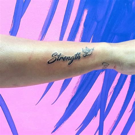 50 Latest Female Strength Symbol Tattoo Designs To Inspire You In 2024