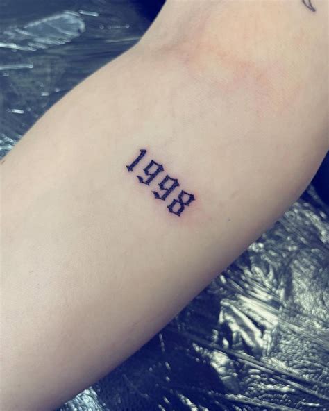 Amp Quot 1998 Amp Quot Lettering Tattoo On The Ankle