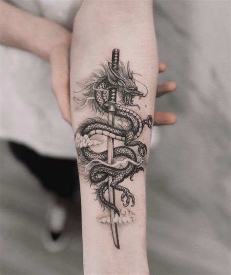 Elegant Sword Tattoos 46 Sword Dragon Tattoo Designs To Add An Edge To