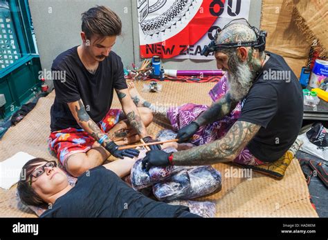 England London London Tattoo Convention Tattooist At Work Stock England London London Tattoo Convention Tattooist At Work Stock