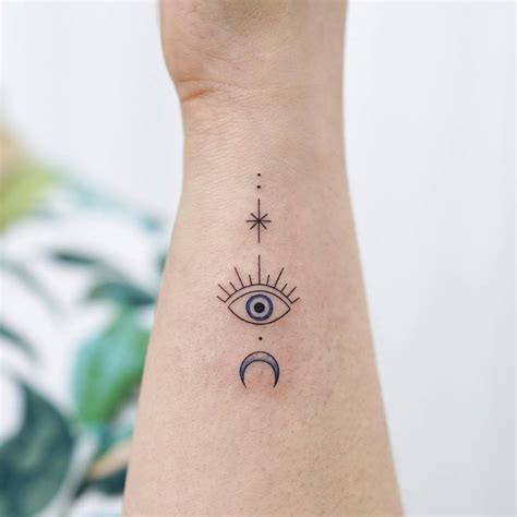 Evil Eye Tattoo Located On The Wrist Minimalistic Evil Eye Tattoo Located On The Wrist Minimalistic