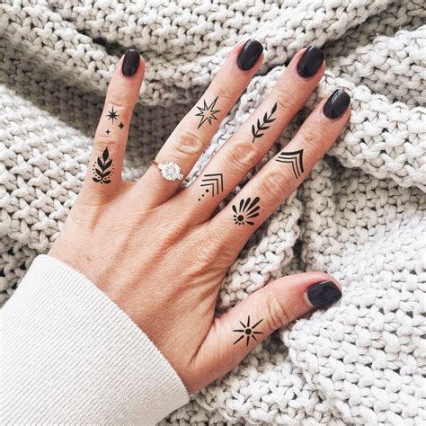 Female Knuckle Tattoos 70 Stylish And Unique Finger Tattoo Ideas