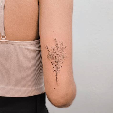 Fine Line Style Flower Bouquet Tattoo Located On The