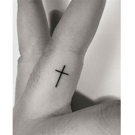 Finger Cross Tattoo