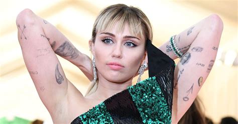 Miley Cyrus Amp 39 Tattoos Guide To All Her Ink And Their Meanings Miley Cyrus Amp 39 Tattoos Guide To All Her Ink And Their Meanings
