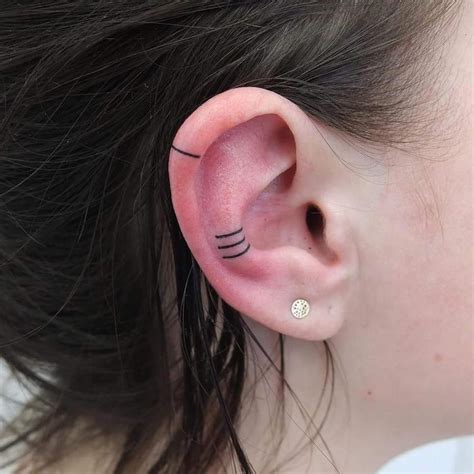 Minimalist Ear Tattoo Trend Has People Getting Tiny Tattoos On Ear Minimalist Ear Tattoo Trend Has People Getting Tiny Tattoos On Ear