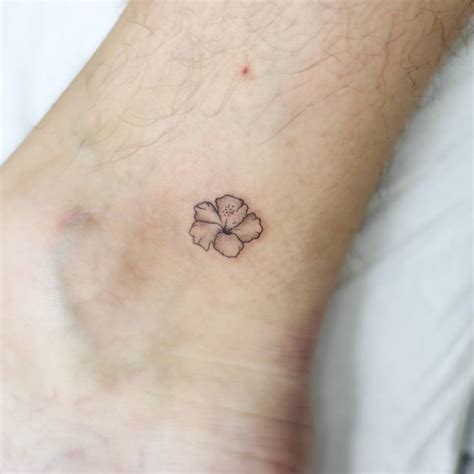 Minimalistic Style Hibiscus Flower Tattoo Located On Minimalistic Style Hibiscus Flower Tattoo Located On