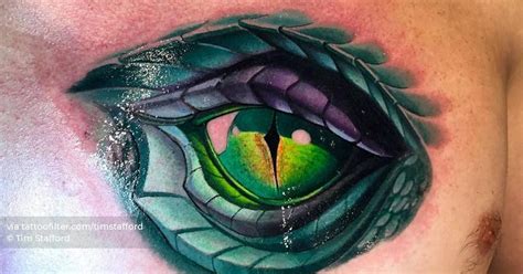 New School Dragon Eye Tattoo On The Chest