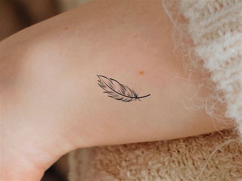 Pluma De Angel Tattoos