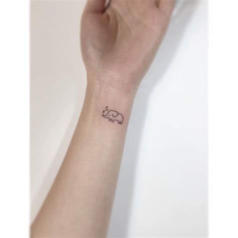 Tiny Elephant Tattoo Located On The Wrist Tiny Elephant Tattoo Located On The Wrist