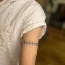 Top Band Tattoo Designs Chosen By Celebrities Their Meaning Holistic Ink Top Band Tattoo Designs Chosen By Celebrities Their Meaning Holistic Ink